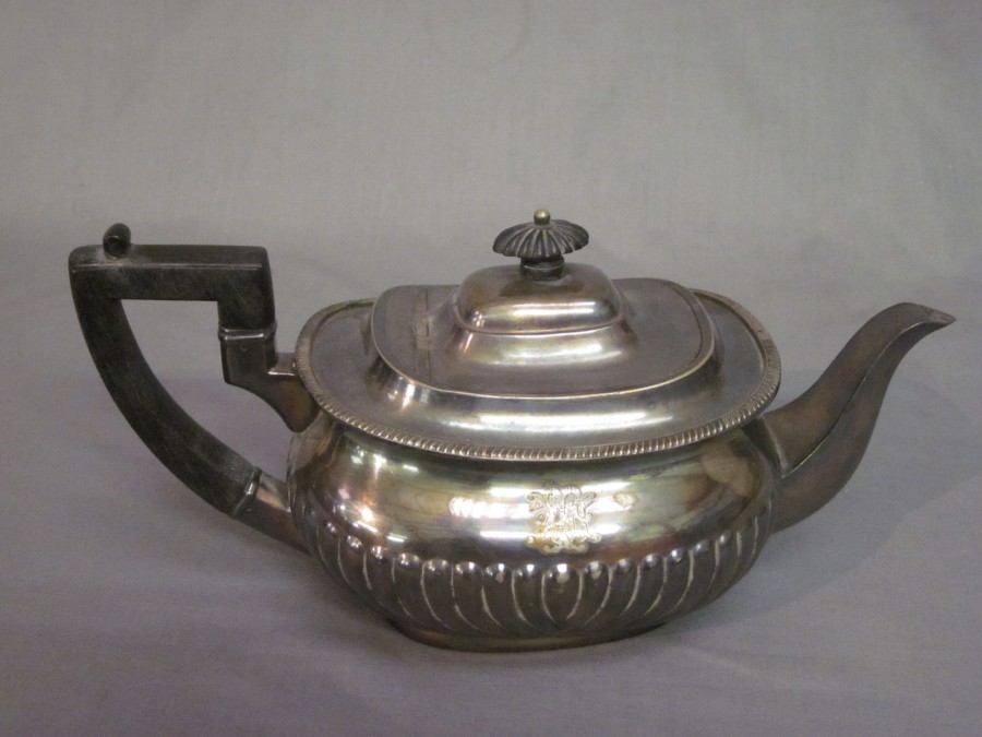 An oval silver plated teapot with demireeded 1st September 2010
