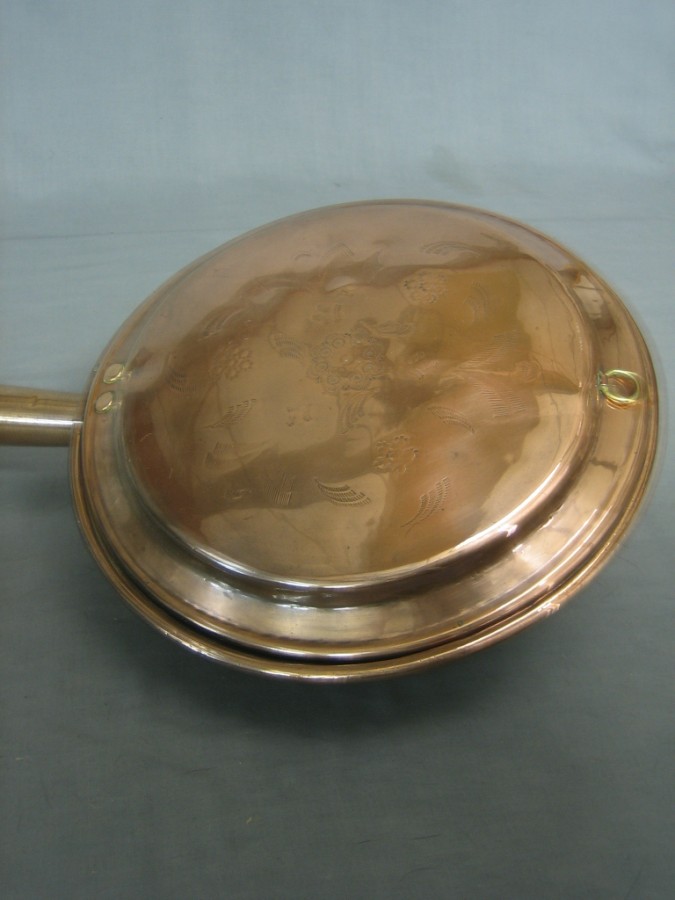 An 18th/19th Century copper warming pan with turned 20th October 2010