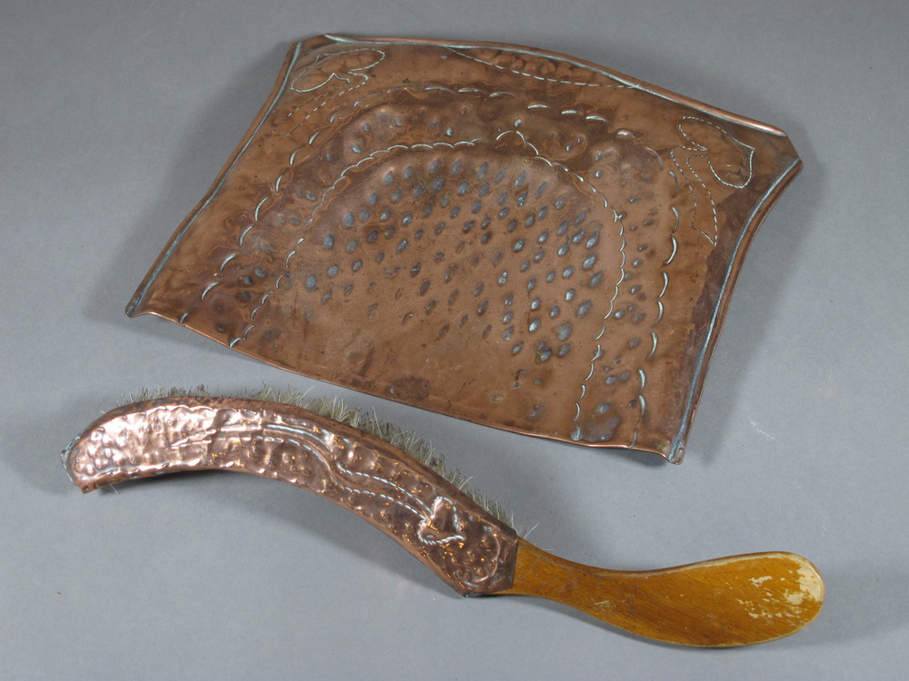 An Art Nouveau embossed copper crumb tray and brush 20th February