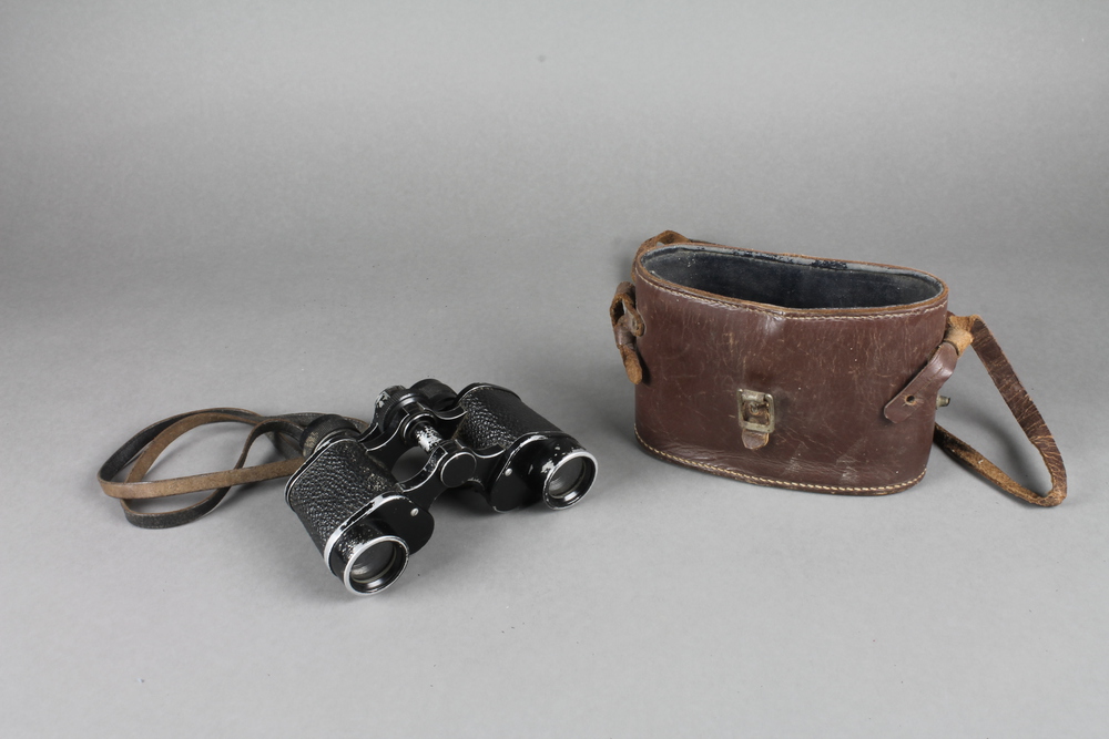 A pair of field glasses complete with leather carrying 20th March 2013 Denhams