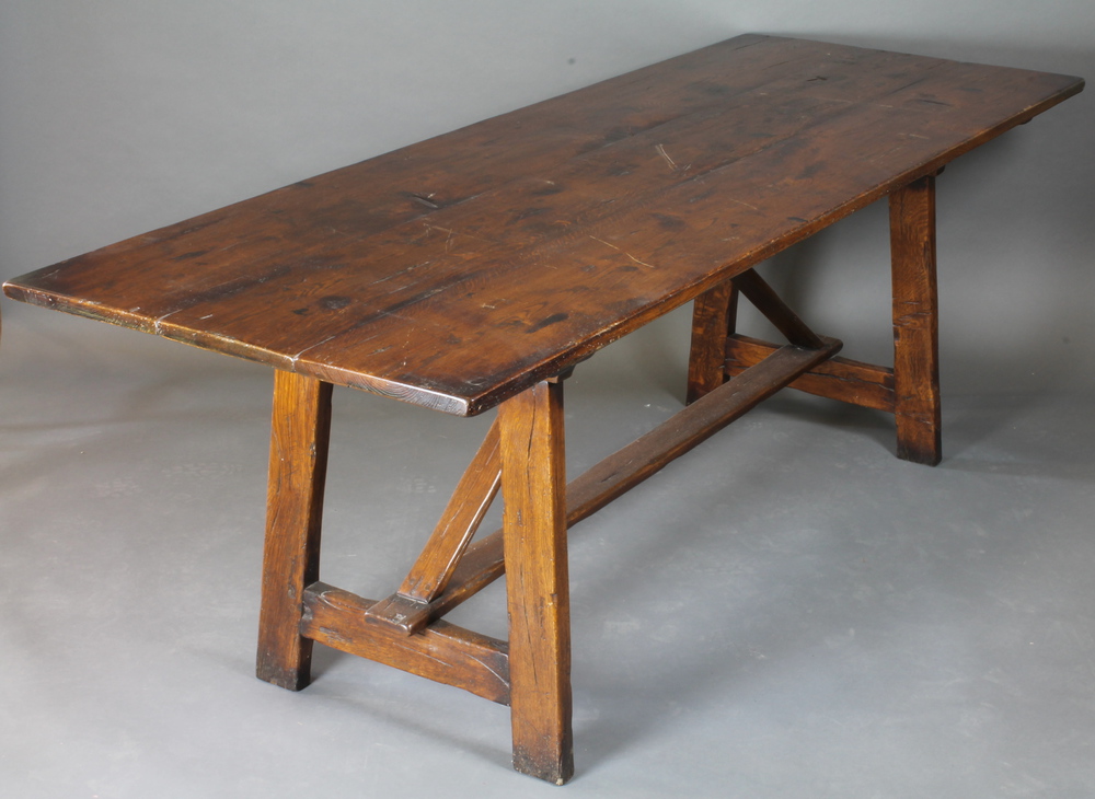 An elm trestle refectory table with planked top, 17th April 2013