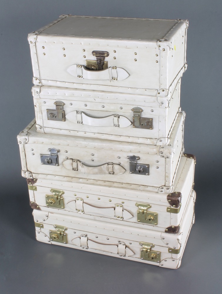 Five white stage prop sealed suitcases, 2 7" x 14" x 18th November