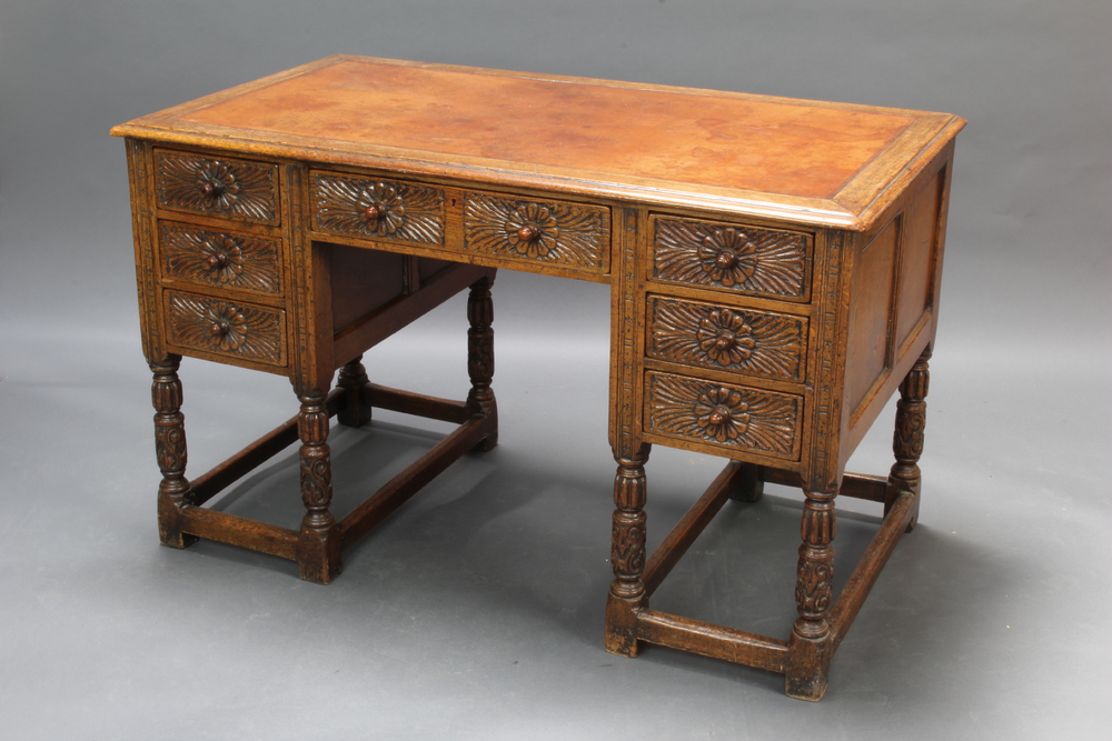 An Ipswich style carved oak desk with tan inset 23rd May 2018 Denhams