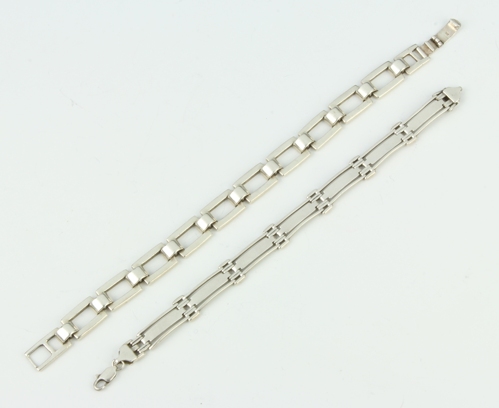 A Silver Flat Link Bracelet And 1 Other Bracelet 50 23rd October a-silver-flat-link-bracelet-and-1-other-bracelet-50-23rd-october