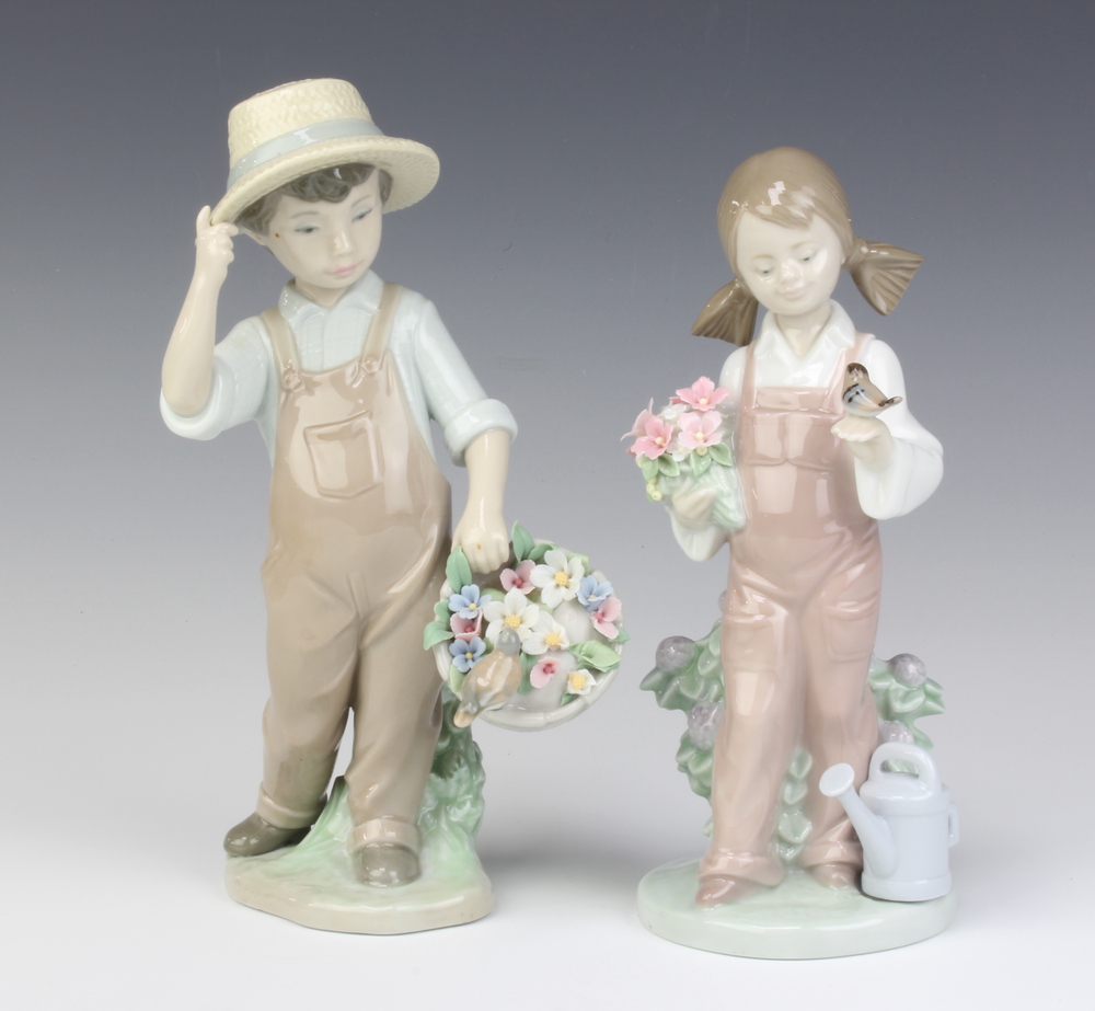 A Lladro figure of a boy holding a basket of flowers, 26th February