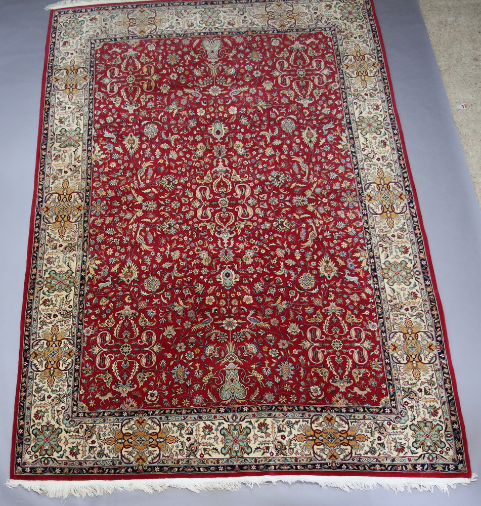 A red and floral patterned North West Persian carpet 4th November