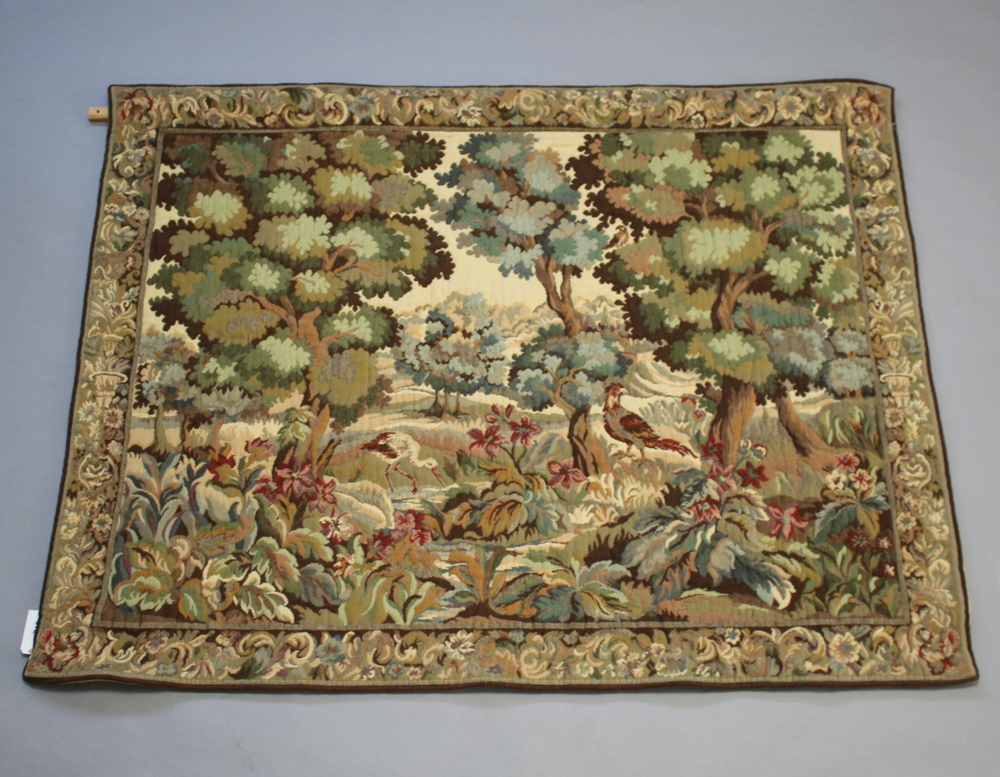 A machine made tapestry panel decorated birds amidst a 2nd December
