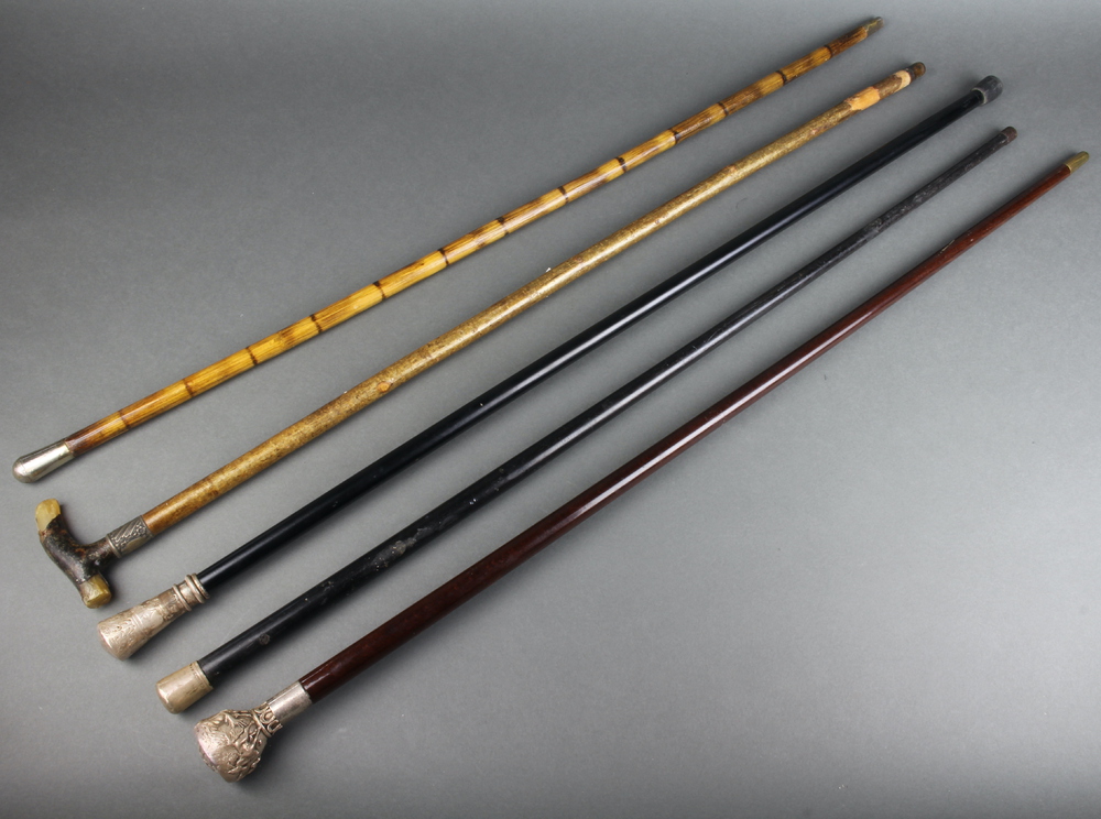 A hardwood walking cane with repousse white metal knop 10th March