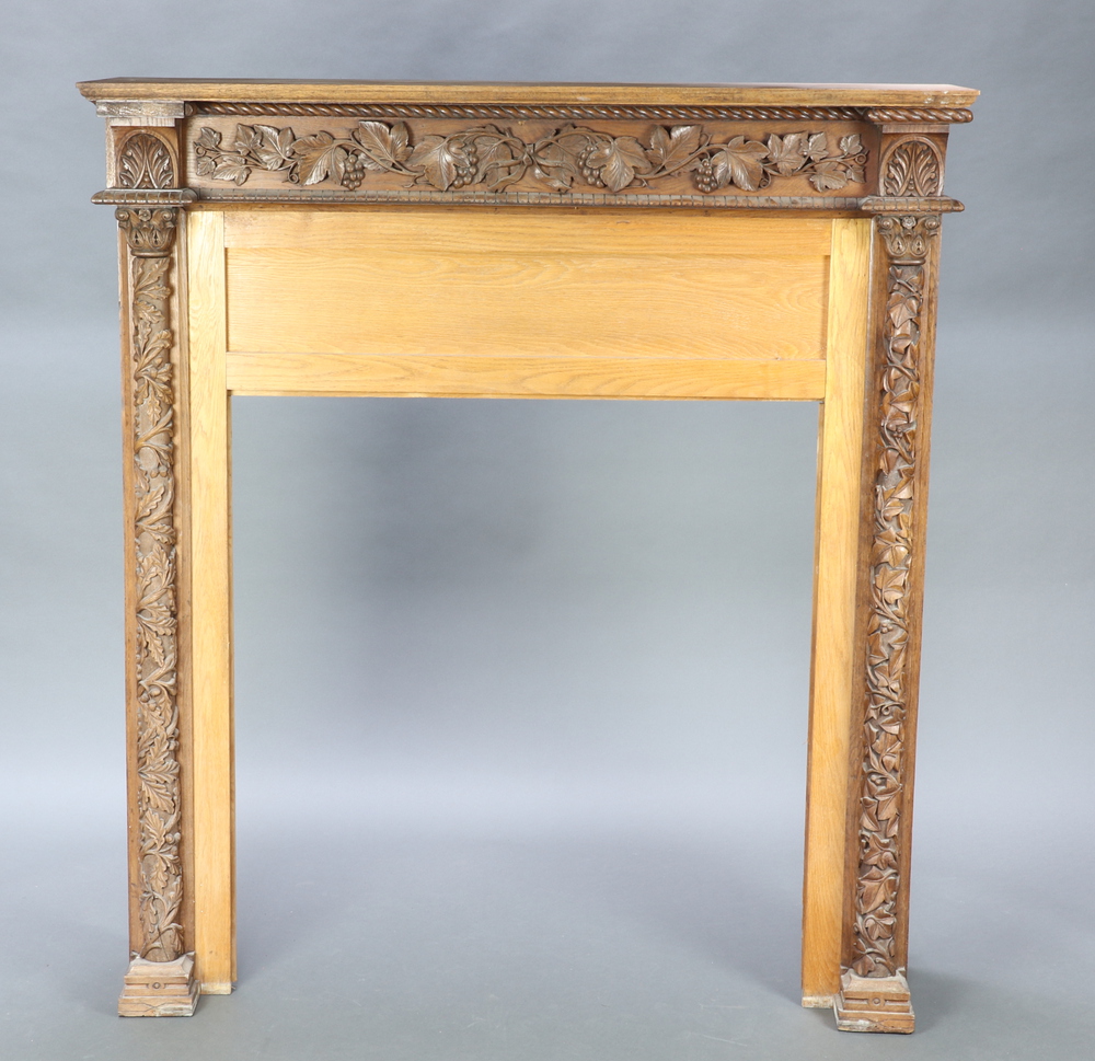 A Victorian oak fire surround with carved vinous 24th August 2022