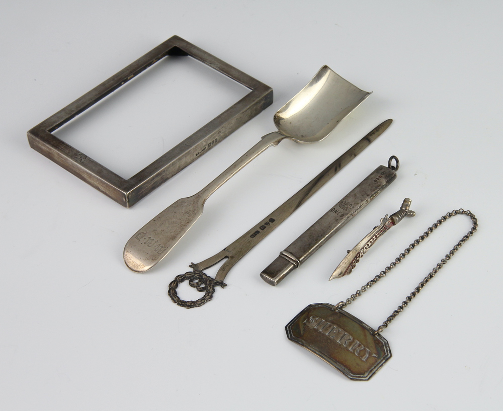 An Edinburgh silver sugar spoon, paperweight, pencil 16th November