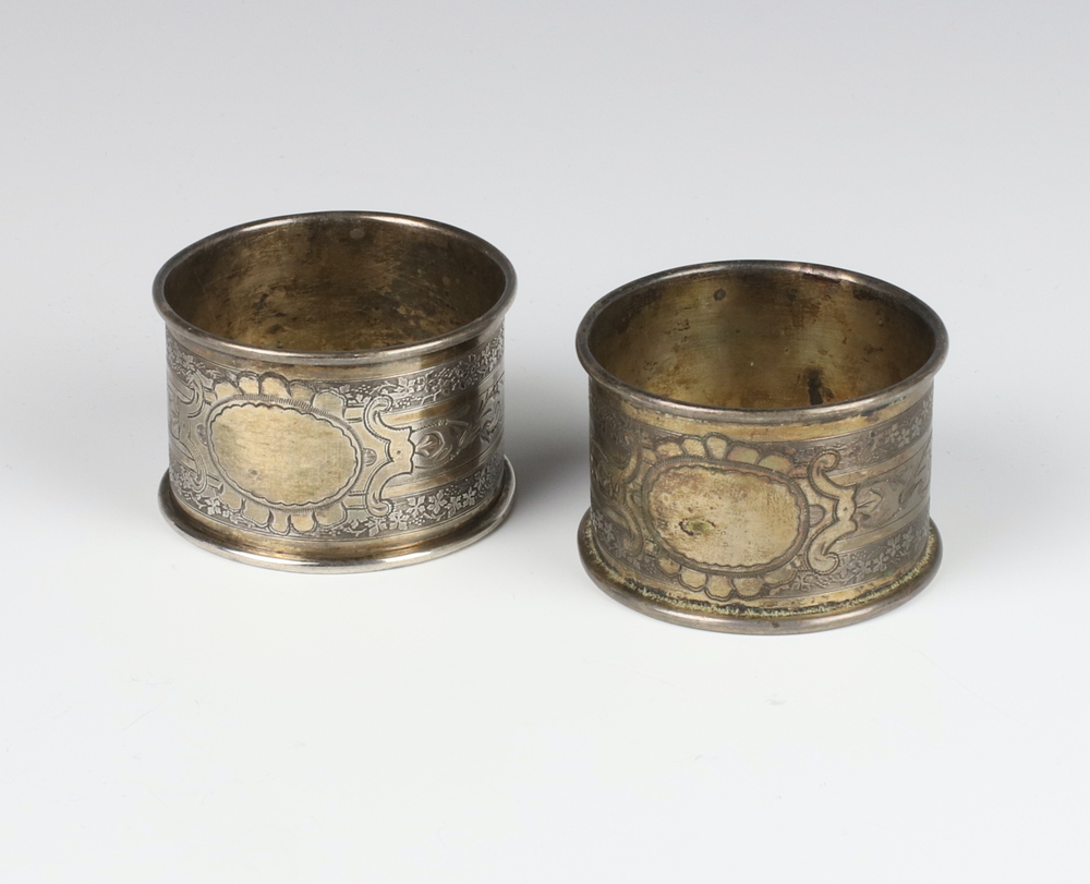 A pair of 800 standard napkin rings engraved with 25th January 2023