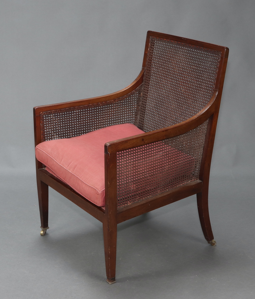 An Edwardian mahogany single cane library chair with 23rd March 2023