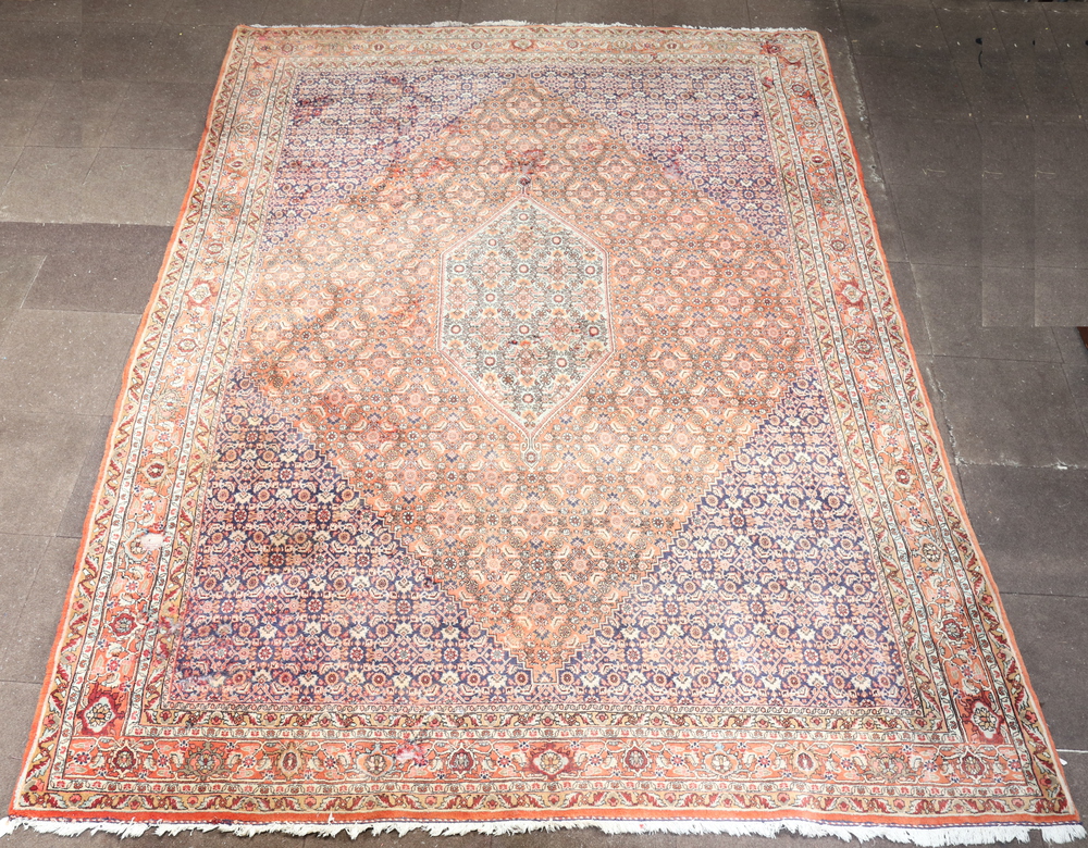 A pink, blue and white ground Persian carpet with 13th July 2023