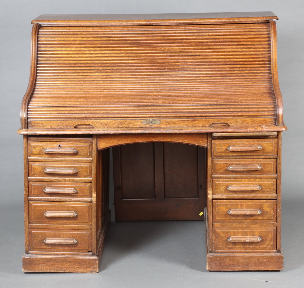 A 19th Century oak roll top desk, the interior fitted 2nd October
